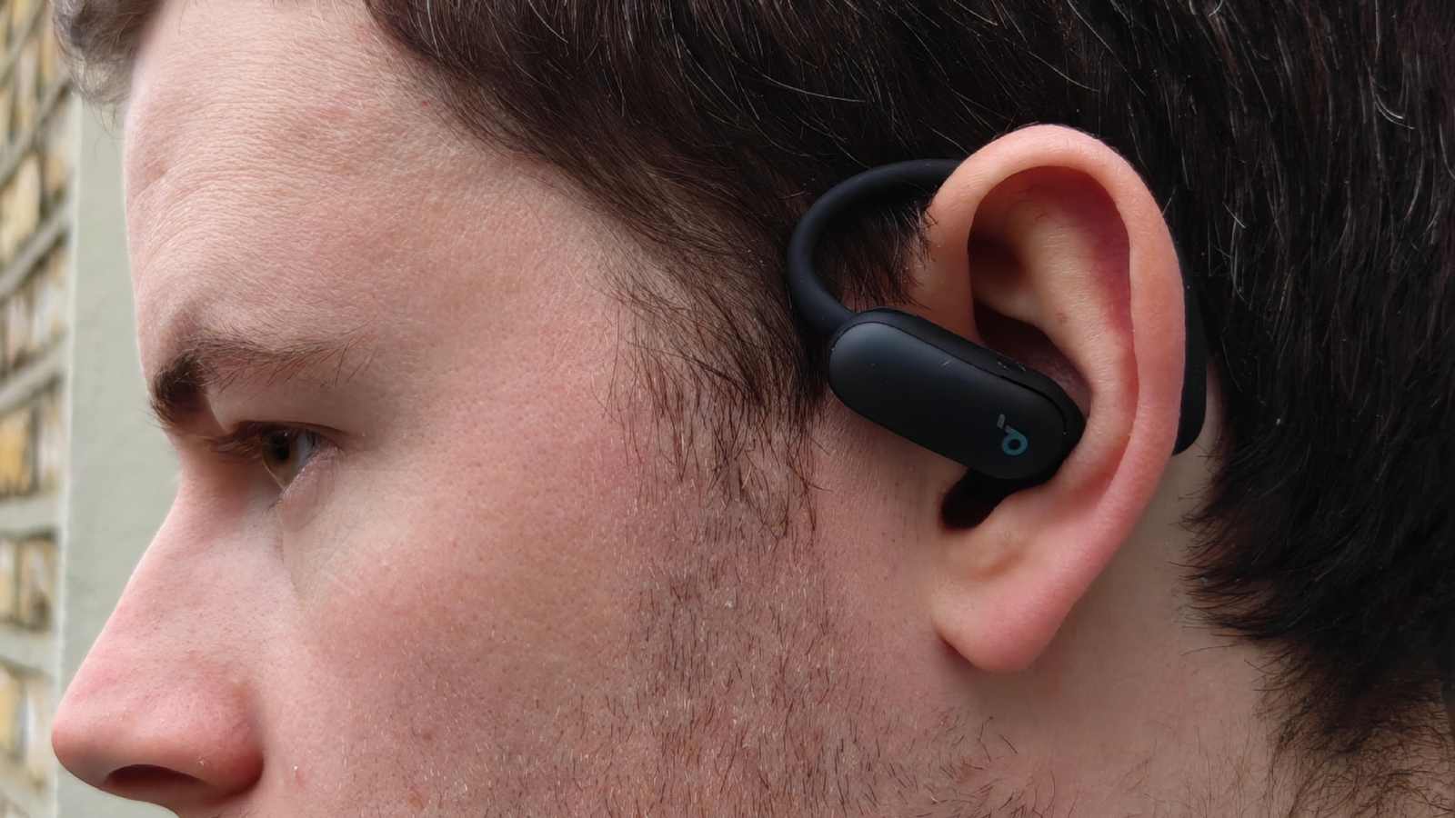 The Soundcore Aerofit 2 Pro in a man's ear, in ANC mode.