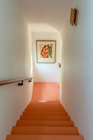 Orange floor across stairs