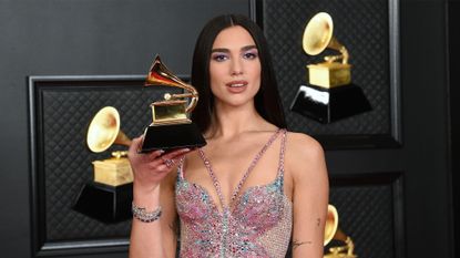 LOS ANGELES, CALIFORNIA - MARCH 14: Dua Lipa, winner of Best Pop Vocal Album for ‘Future Nostalgia’, poses in the media room during the 63rd Annual GRAMMY Awards at Los Angeles Convention Center on March 14, 2021 in Los Angeles, California. (Photo by Kevin Mazur/Getty Images for The Recording Academy )