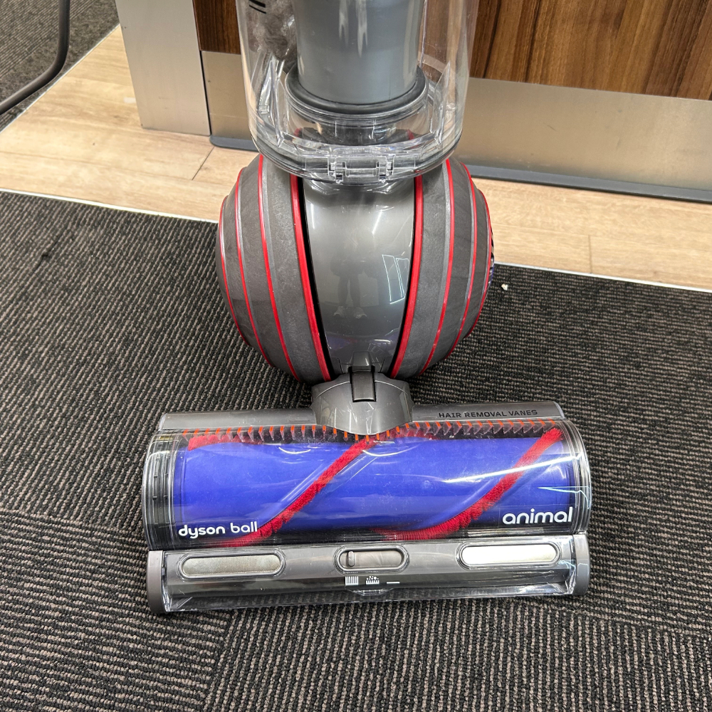 Close-up shot of the floorhead on the Dyson Ball Animal 3 Upright Vacuum Cleaner, one of the best vacuum cleaners for pet hair