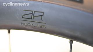A black wheel rim with AR HOOKLESS written on it