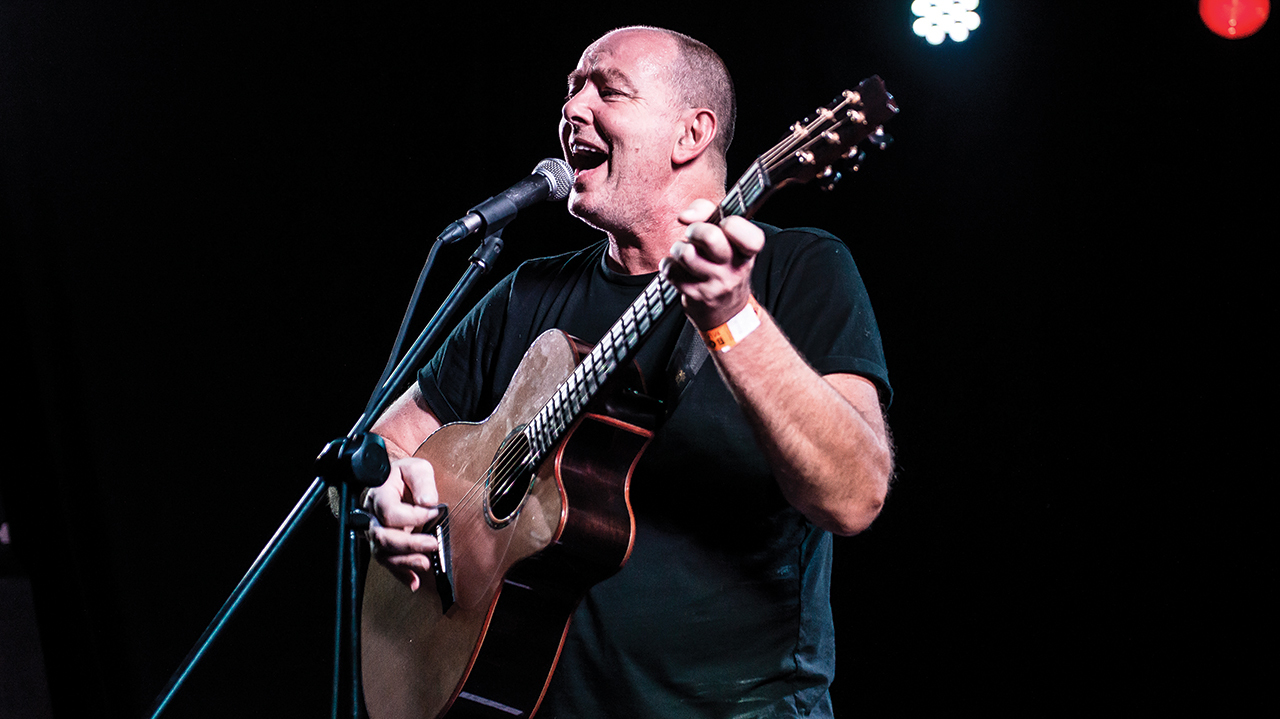 A photograph of Francis Dunnery on stage