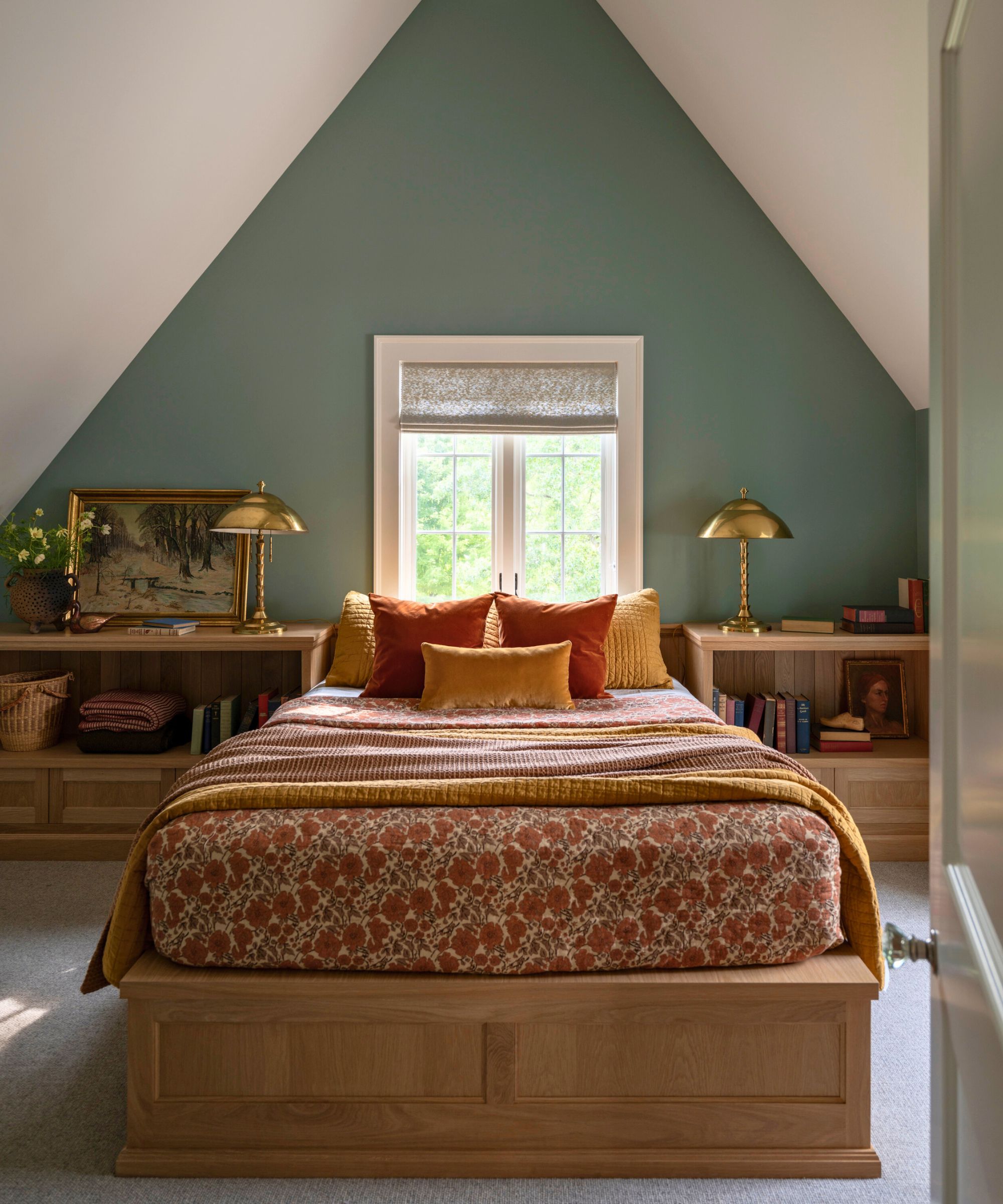 bedroom with green wall and platform bed