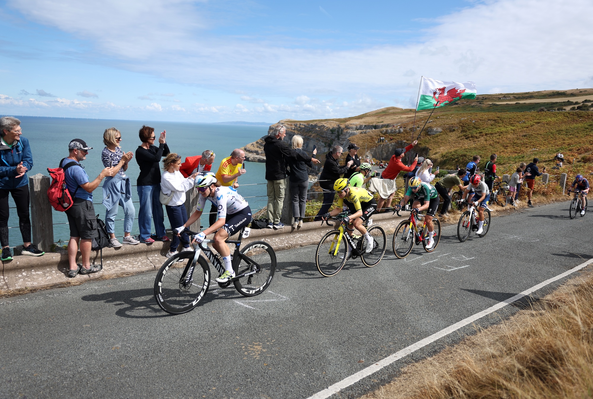Liane Lippert of Movistar Team, Femke De Vries of Visma-Lease a Bike, Lorena Wiebes of SD Worx - Protime (in the Green Leader Jersey) and Fleur Moors of Lidl - Trek (in the White Best Young Rider Jersey) compete in the chase group