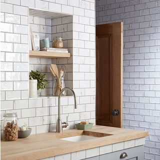 white bricked tiles kitchen walls with countertop