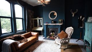 a blue living room with a fireplace