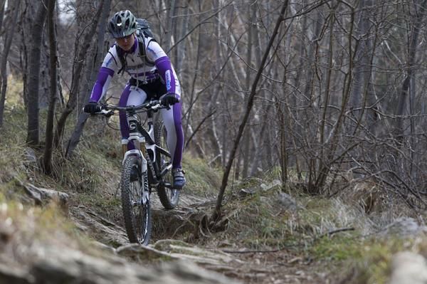 Sue George (Cyclingnews) chases the Cannondale Factory Racing team down the trail at the team's camp