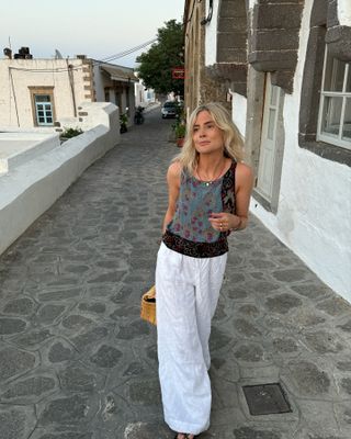 Lucy Williams wearing white linen pants.