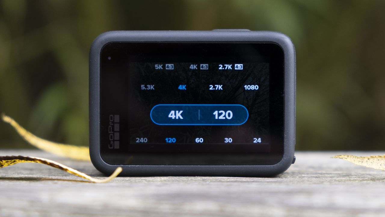 The GoPro Hero 10 Black action camera sitting on a wooden bench