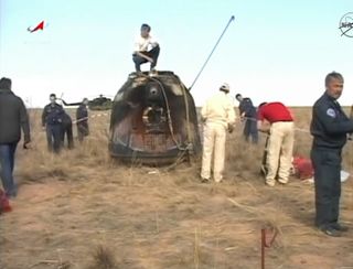 The Russian Soyuz TMA-21 space capsule is seen in this still image from a NASA TV broadcast of the landing of three International Space Station crewmembers in Kazakhstan on Sept. 15, 2011.