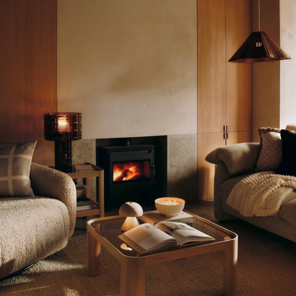 M&S Double Layer Shade Glass Base Table Lamp in cosy living room with log burner.