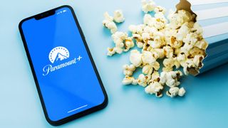 Paramount Plus app on a phone next to popcorn