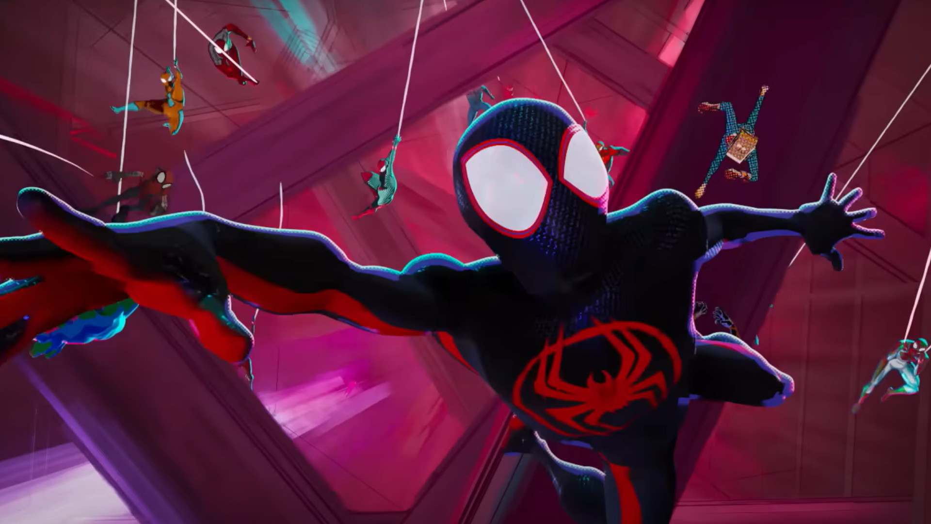 A group of Spider-Men flying through the air during the animated movie Spider-Man: Across the Spider-Verse.