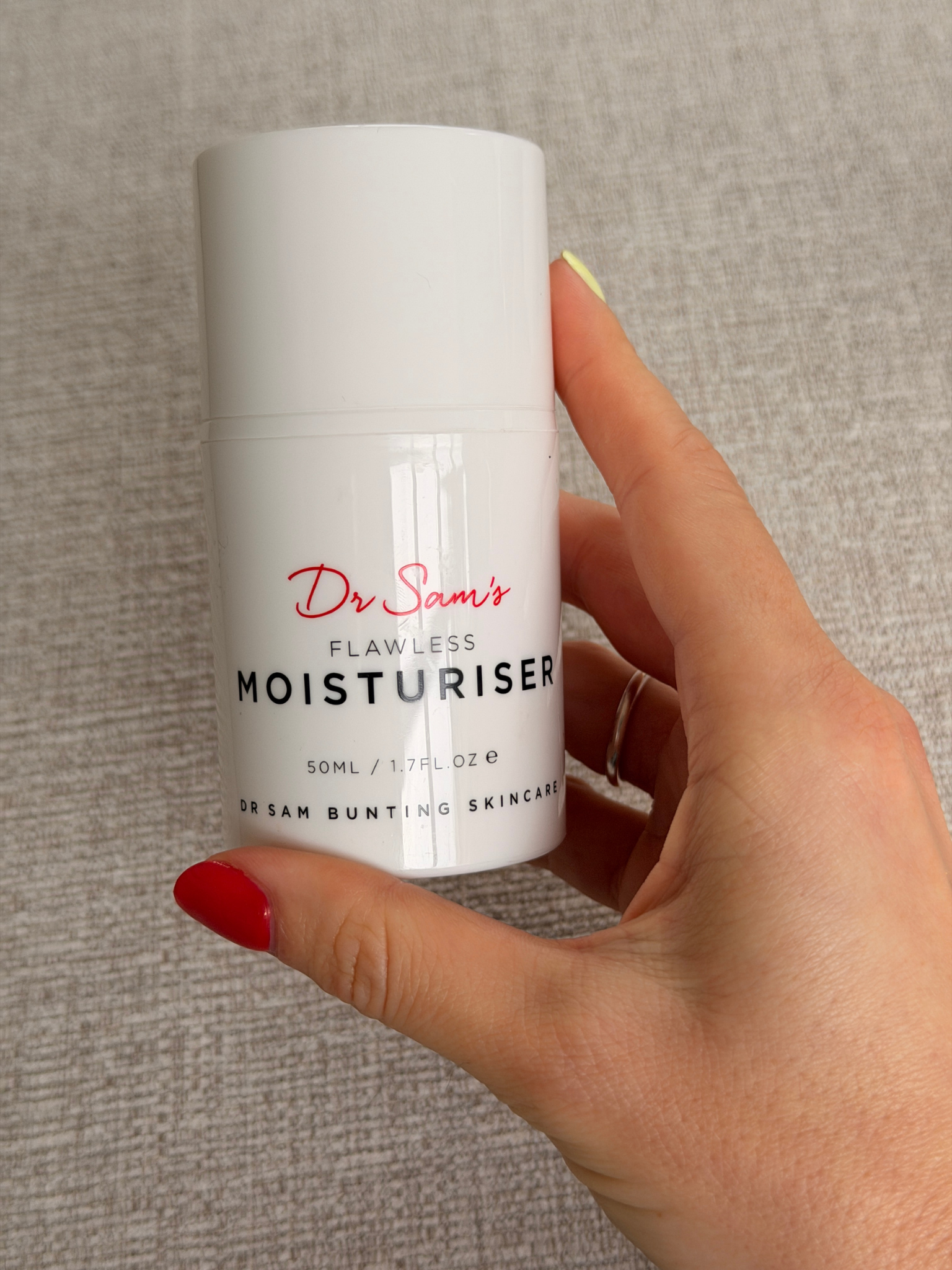 Freelance beauty editor Grace Day holding the Dr. Sam's moisturiser