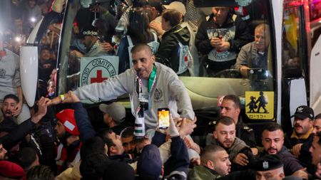 Former Palestinian prisoner Zakaria Zubeidi is lifted by the crowd upon arrival in Ramallah in a Red Cross convoy