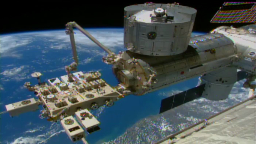 This video frame shows a robotic arm on the International Space Station, called the Japanese Experiment Module Remote Manipulator System, installing NASA&#039;s Cloud-Aerosol Transport System (CATS) on the orbiting lab&#039;s Japanese Experiment Module on Jan. 22, 