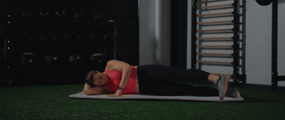 CrossFit athlete Laura Horvath performing side lying hip circles