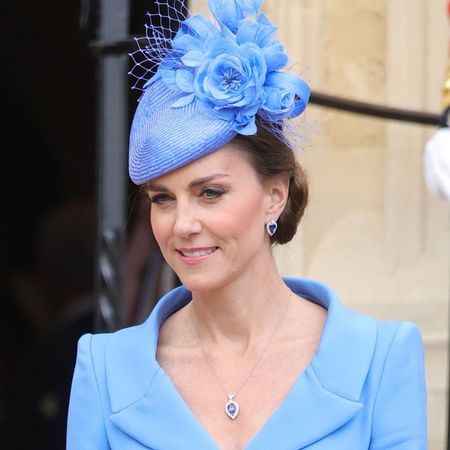 Princess Kate wearing a blue hat and coat