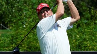 Donald Trump hits a drive