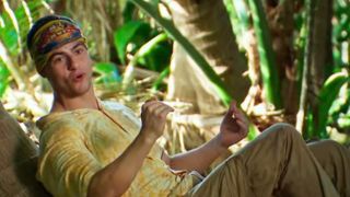 Sam lays against a tree and talks about strategy on Survivor.