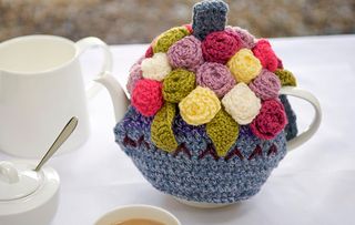 Ornate tea cosy on a teapot