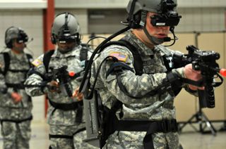 Virtual simulators allow cadets to practice patrolling as a squad in a town, enter and clear a building, and perform other simulated operations.