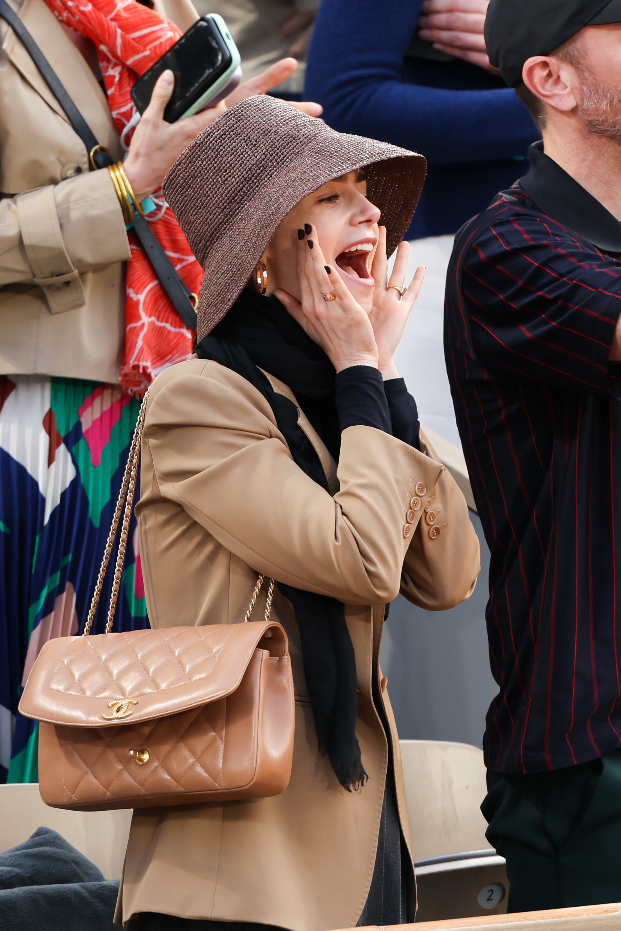 Lily Collins wore a tan blazer at the 2025 French open