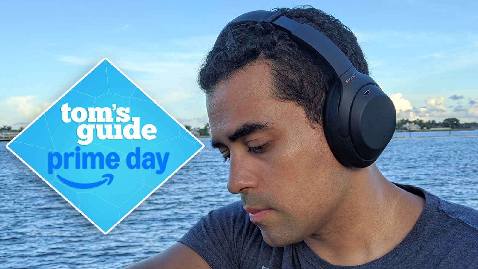 the sony wh1000xm4 headphones being worn at the beach by the reviewer with a tom&#039;s guide deals badge prime day