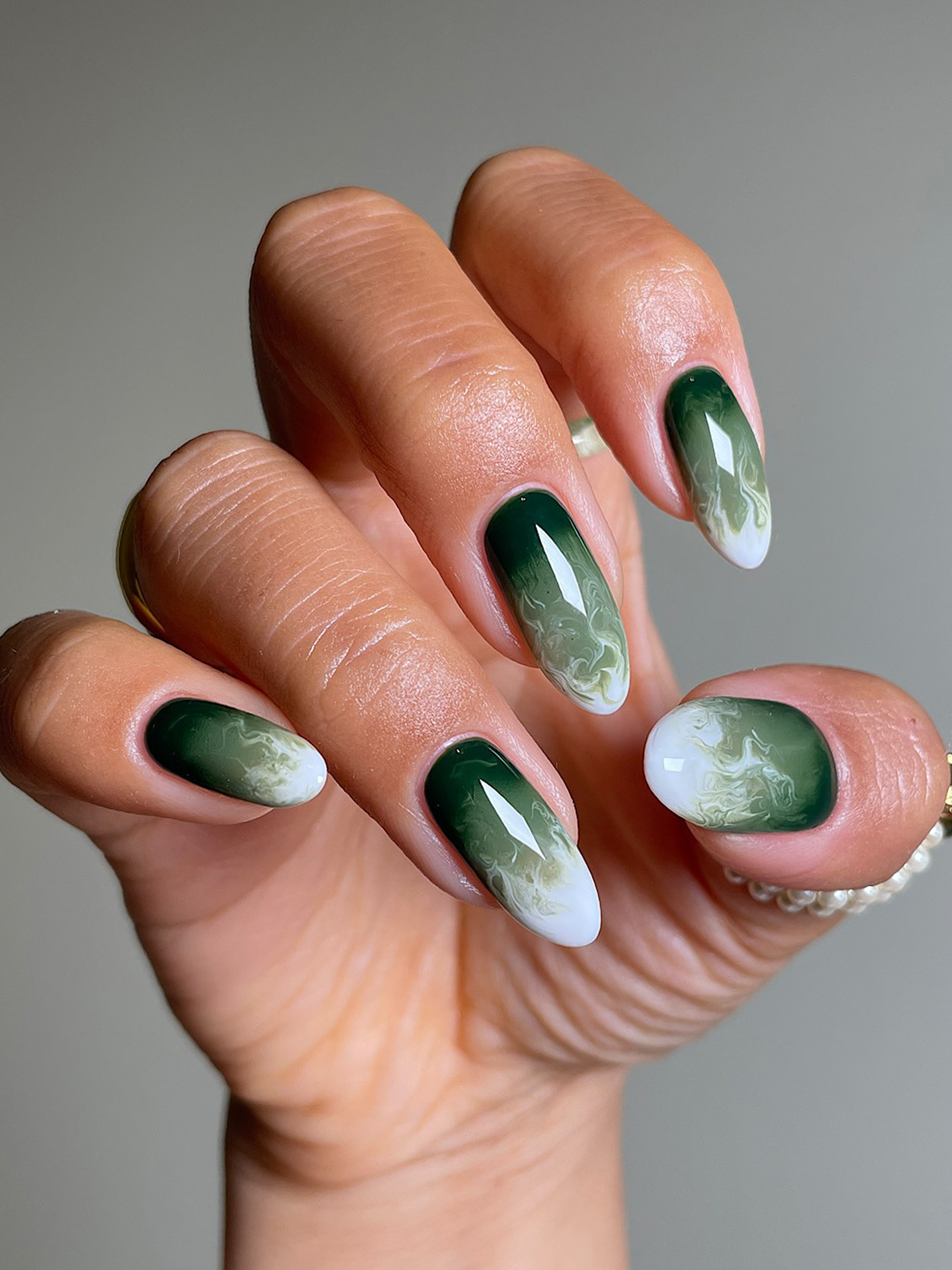 Green and white marble nails by San Sung Kim