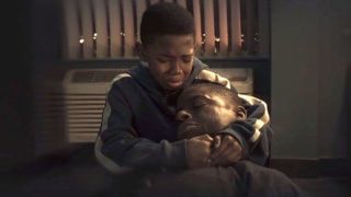 Killmonger mourns his dad as he holds his dead body in Marvel's Black Panther