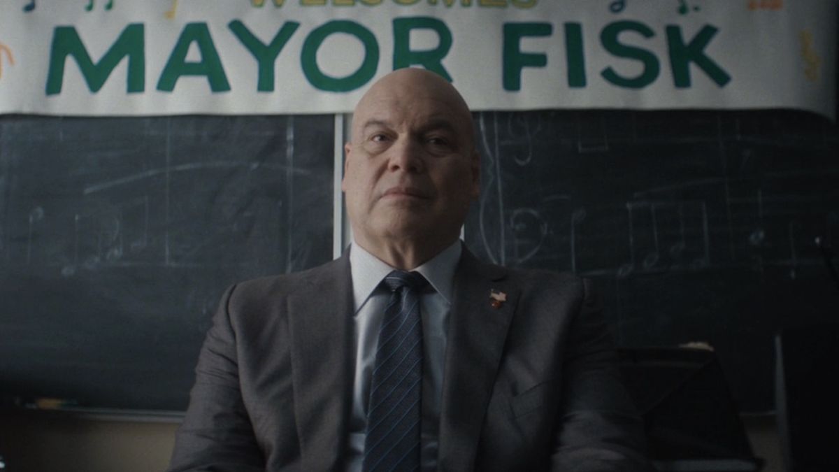 Wilson Fisk seated watching a children&#039;s choir and looking uncomfortable in Daredevil: Born Again