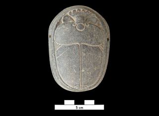 A heart scarab, a type of Egyptian amulet, was found with the burials of Khnummose and the woman who may be his wife.