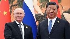 Russia's President Vladimir Putin and Chinese President Xi Jinping shaking hands during a meeting in Beijing on October 18, 2023