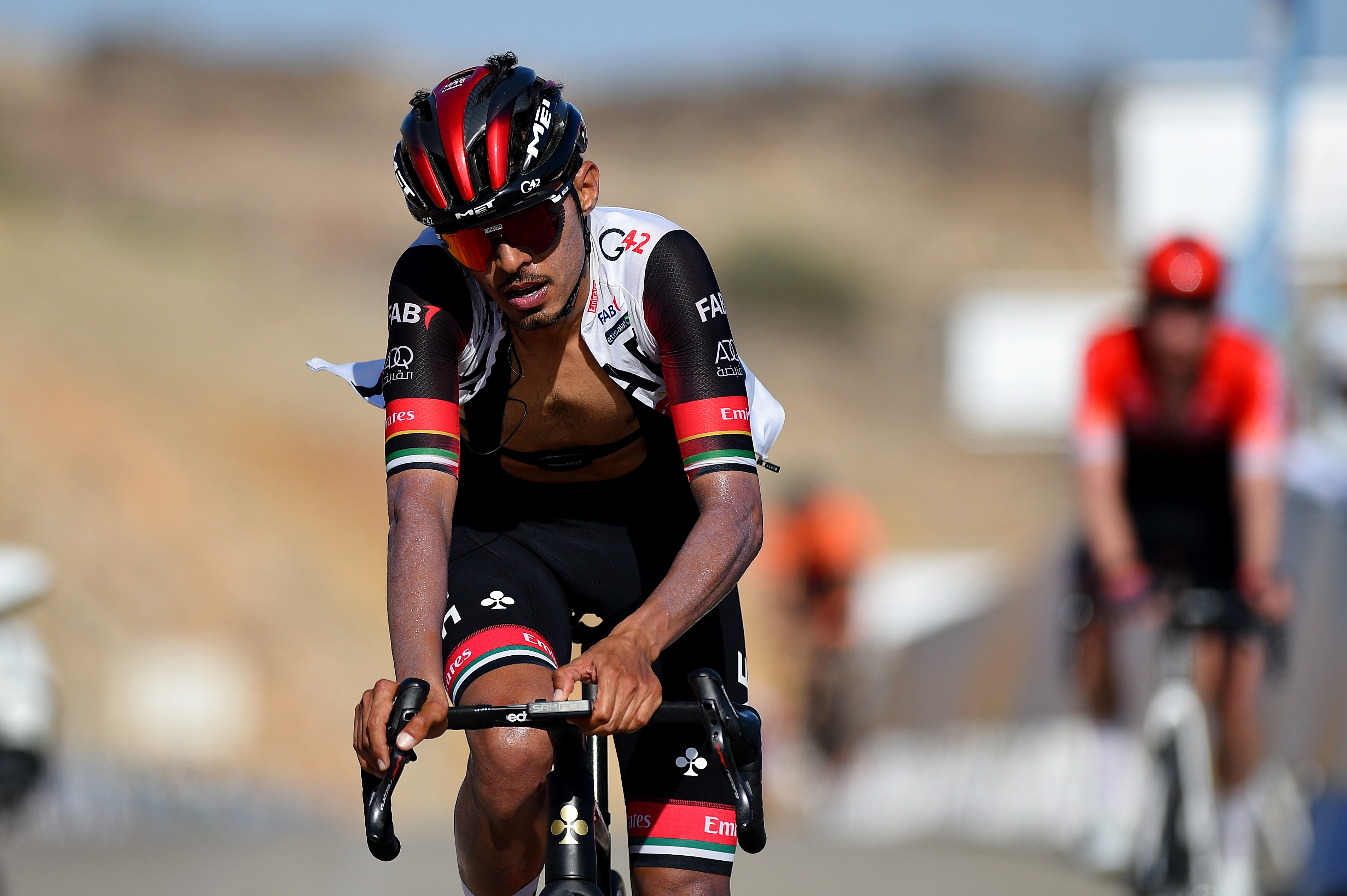 QURAYYAT, OMAN - FEBRUARY 12: Al-Hammadi Yousif Mirza of United Arab Emirates and UAE Team Emirates reacts after cross the finishing line during the 11th Tour Of Oman 2022 - Stage 3 a 180km stage from Sultan Qaboos University to Qurayyat 240m / #TourofOman / on February 12, 2022 in Qurayyat, Oman. (Photo by Dario Belingheri/Getty Images)