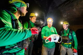 Engineers use the Handheld Universal Lunar Camera (HULC) in a lava tube in Lanzarote, Spain, as part of the PANGAEA training program.