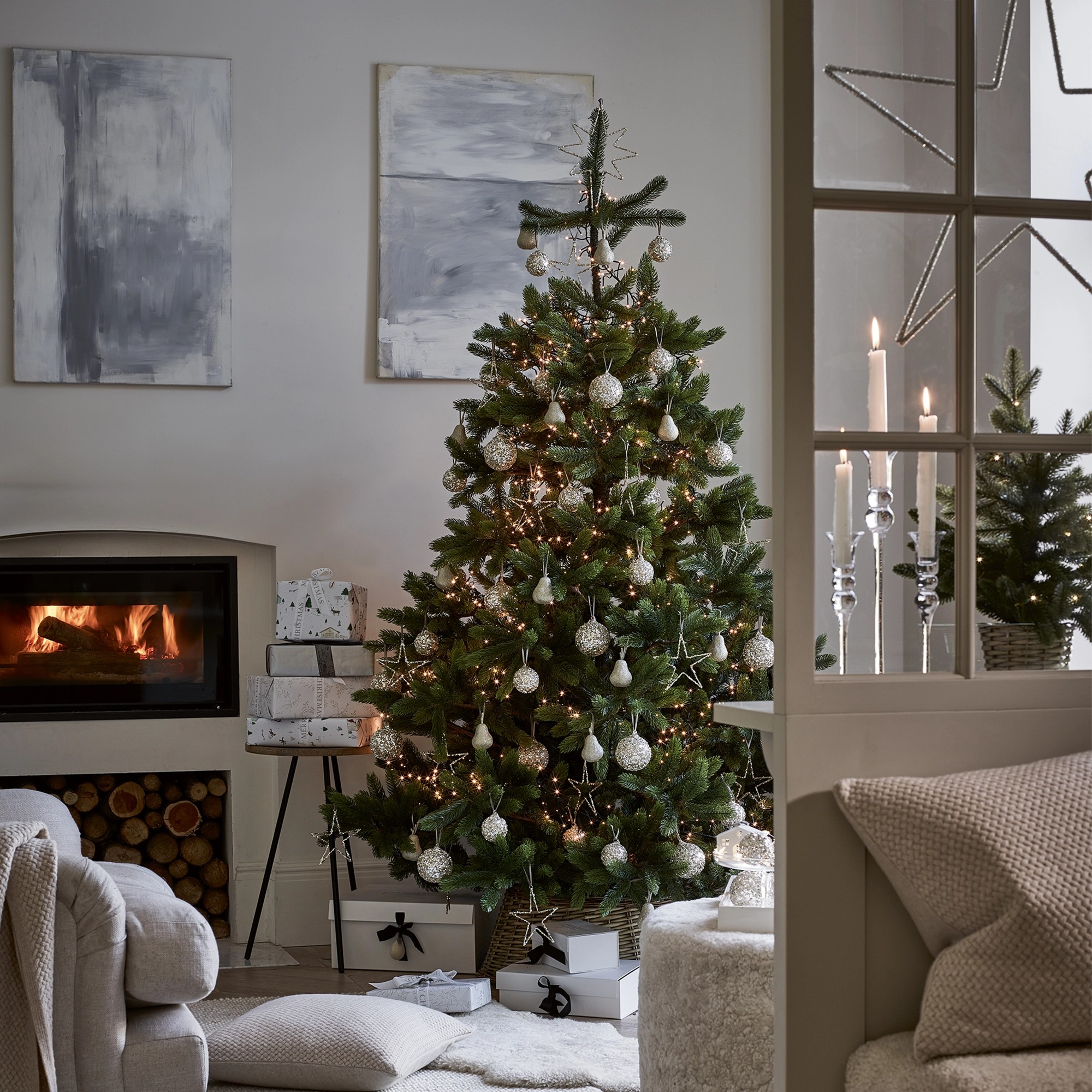 The White Company Symons Nordmann Fir Christmas tree in a living room