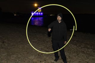 photographer starting to paint a light orb
