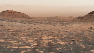a reddish orange dusty landscape