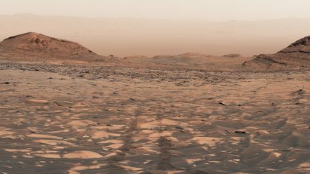 a reddish orange dusty landscape