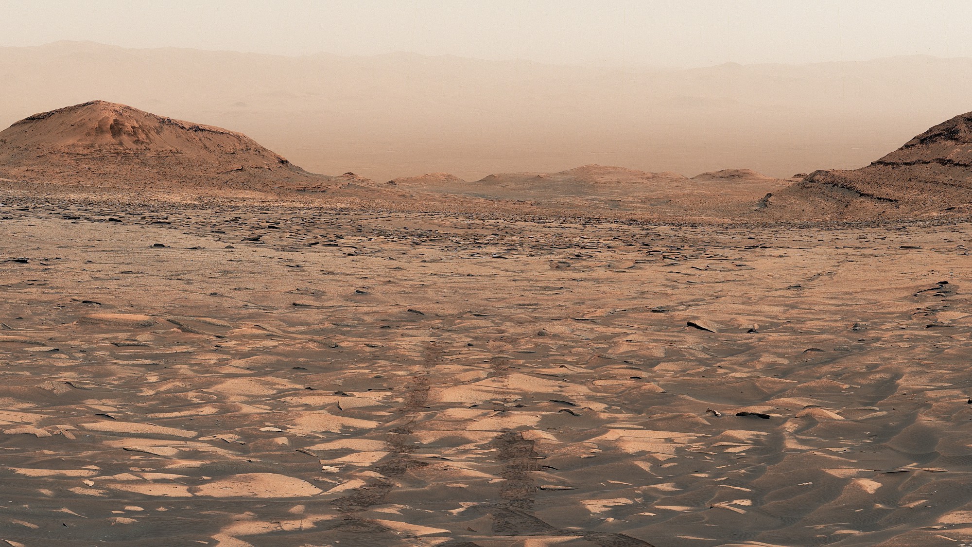 a reddish orange dusty landscape