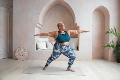Yoga classes: Older Black woman doing yoga