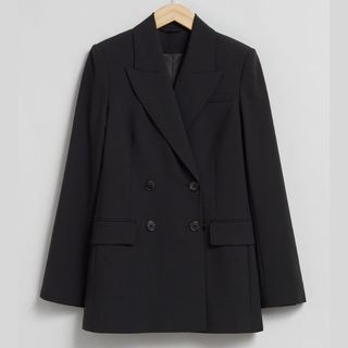 Black tailored wool blazer cut out on hanger 