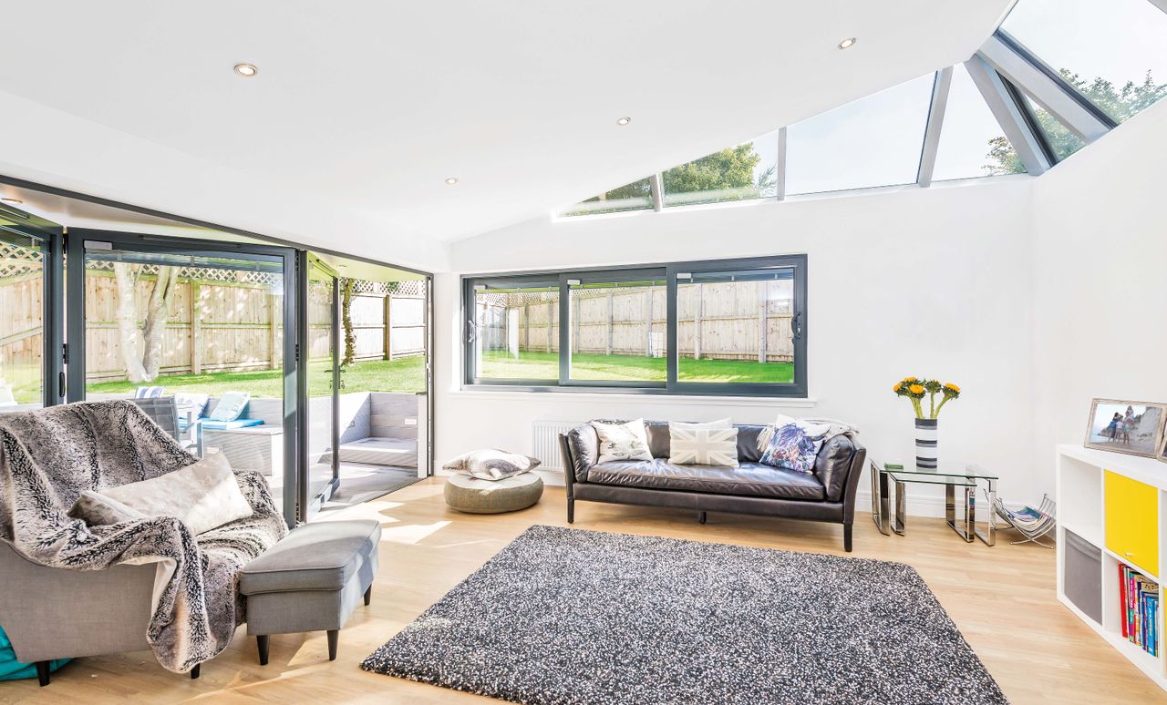large living room extension with roof lights and view to garden