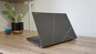 The Asus Zenbook S 14 viewed from behind, showing off its back shell