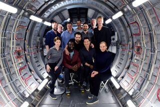 The cast of the 2020 sci-fi thriller "Stowaway" pose for a group photo.