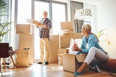 Shot of a mature couple packing boxes on moving day