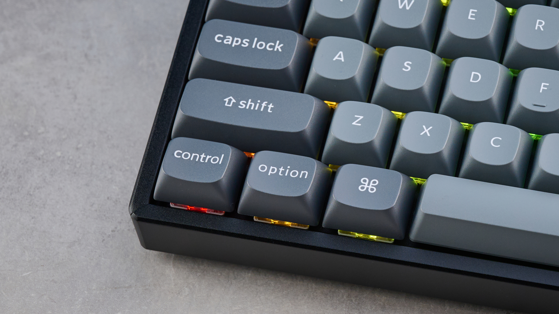 Keychron K8 Max mechanical keyboard in gray photographed on a blue background