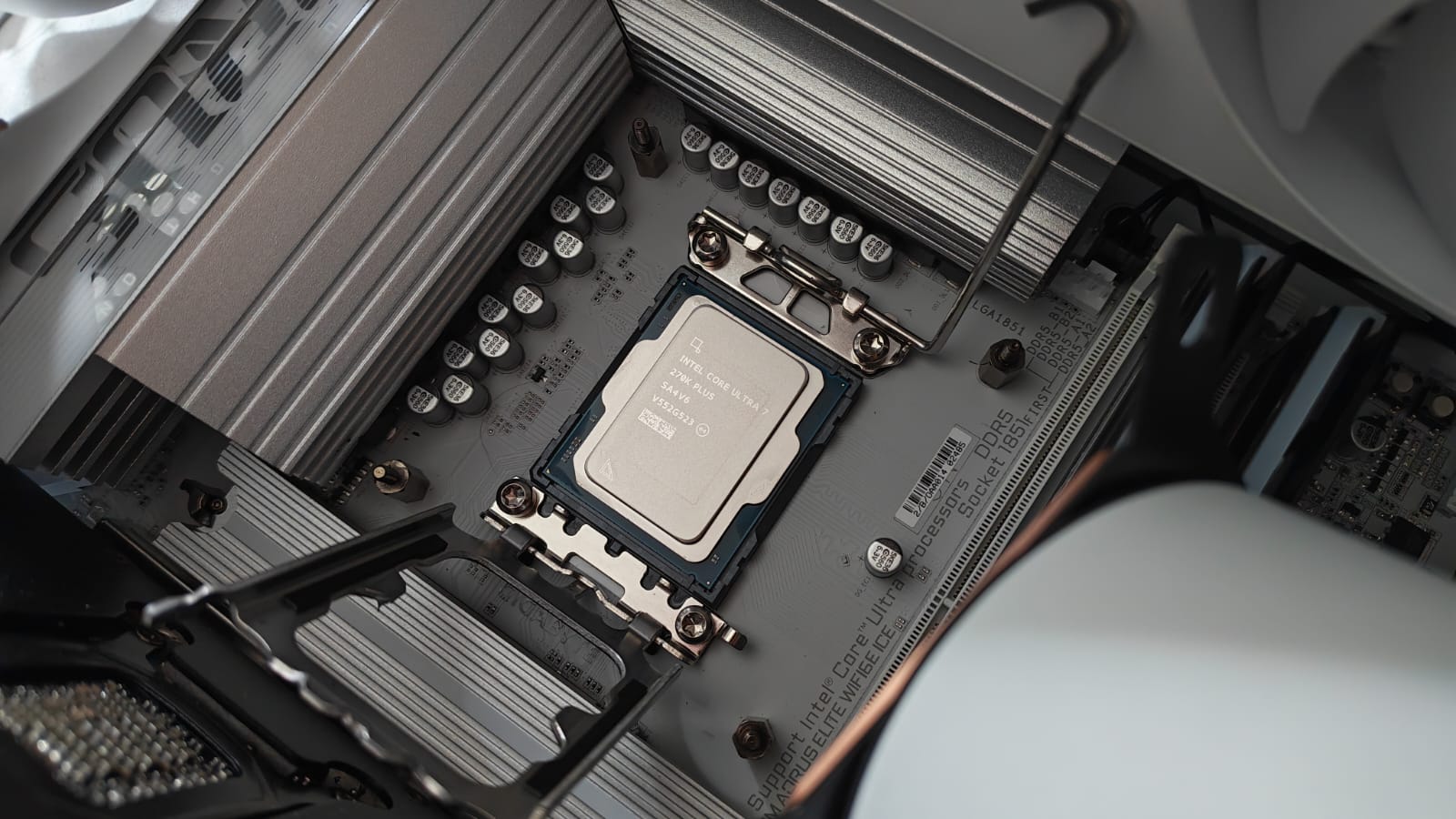 An Intel Core Ultra 7 270K Plus newly seated on the LGA 1851 socket