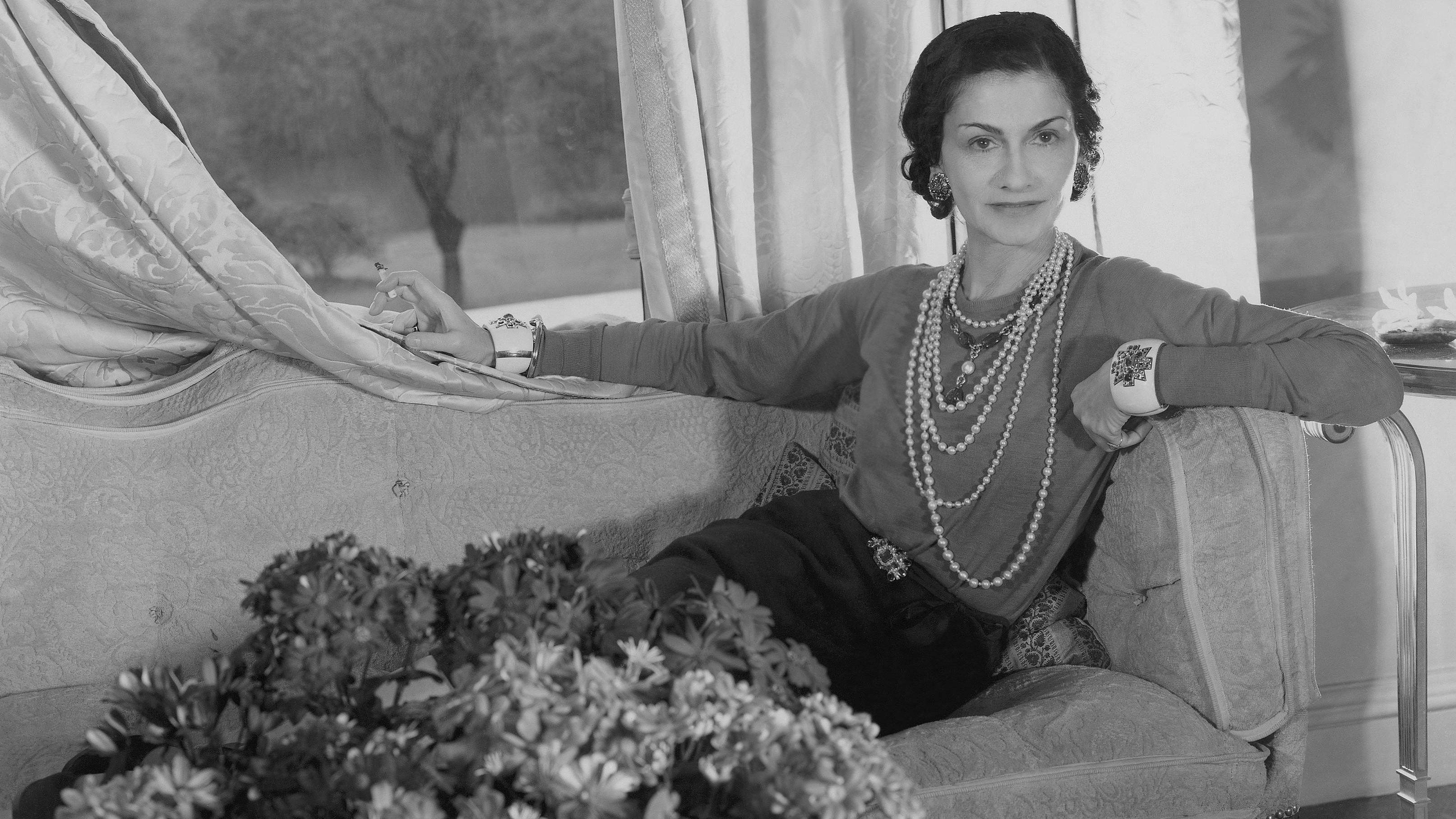 Gabrielle Chanel reclining on a chaise longue