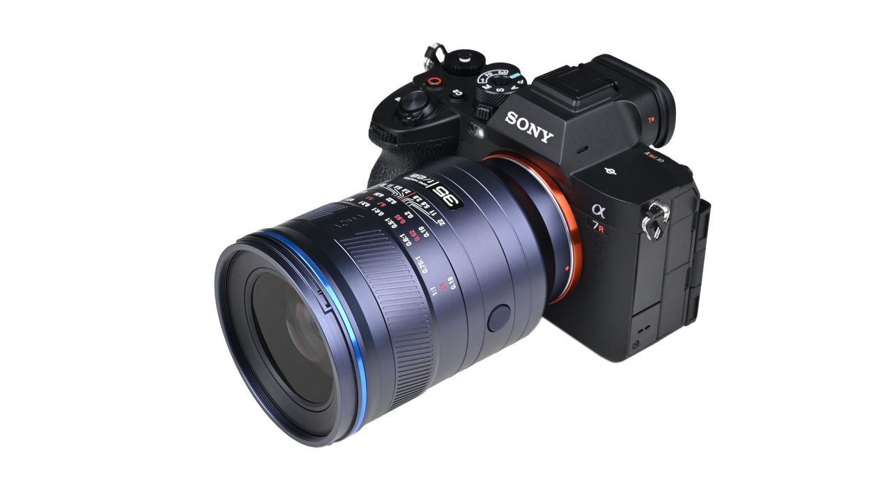 Laowa Acris 35mm f/2.8 1x Macro Apo lens mounted to a camera against a white background